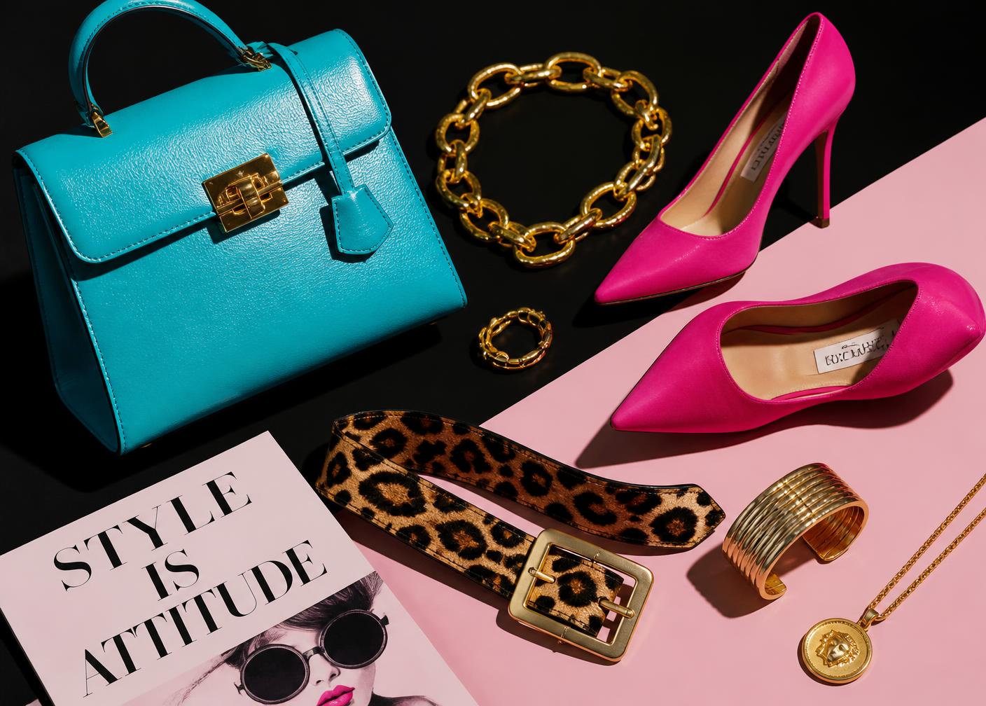 Leopard tote, turquoise jeweled bag, gold chains and crystal earrings styled together